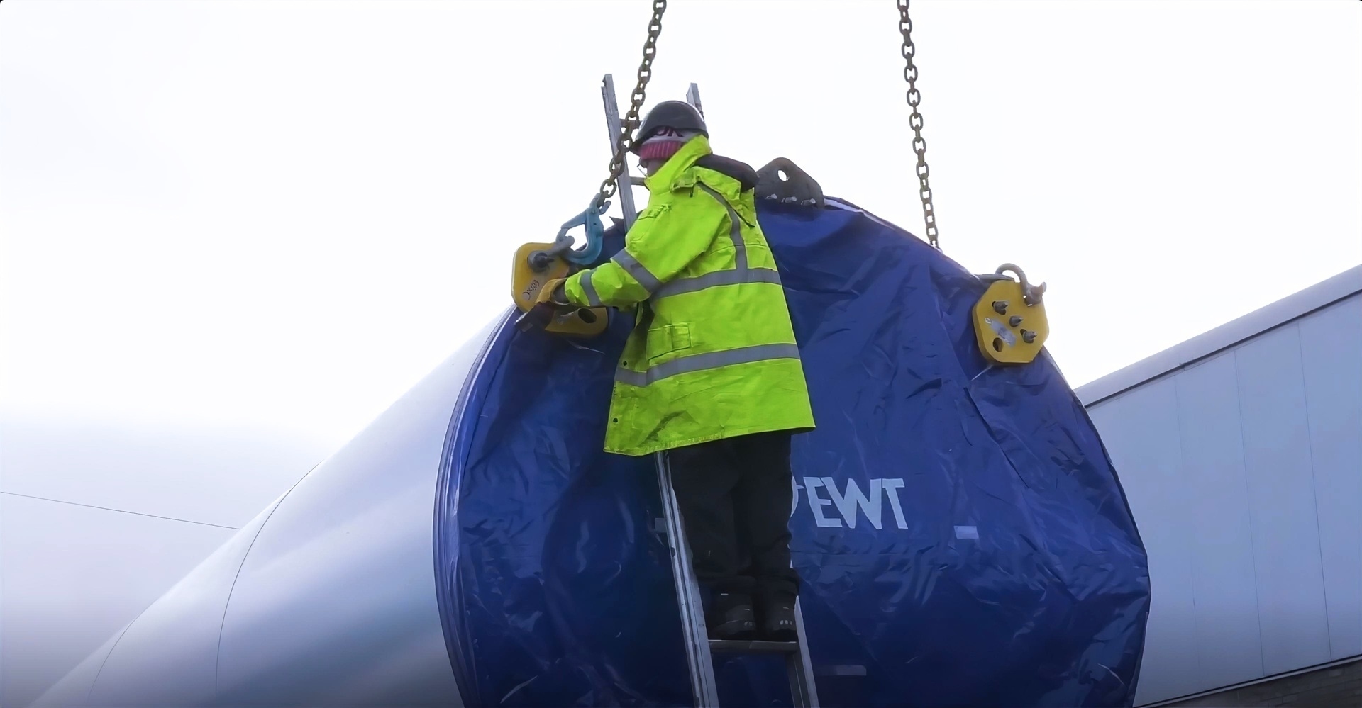 Someone working outside on a windmill